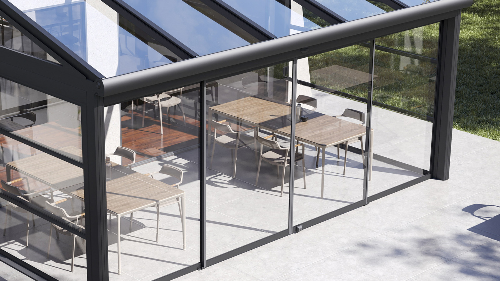 A sleek house with a patio and a transparent glass door, set in a serene outdoor setting.