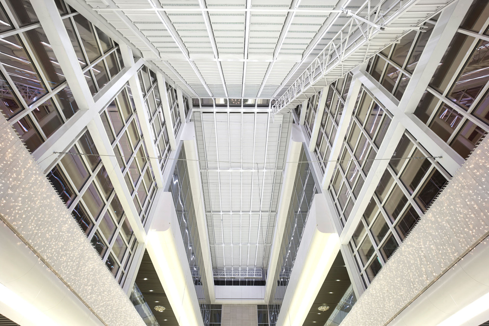 A spacious interior with a massive metal and tailor made fabric pergola roof.