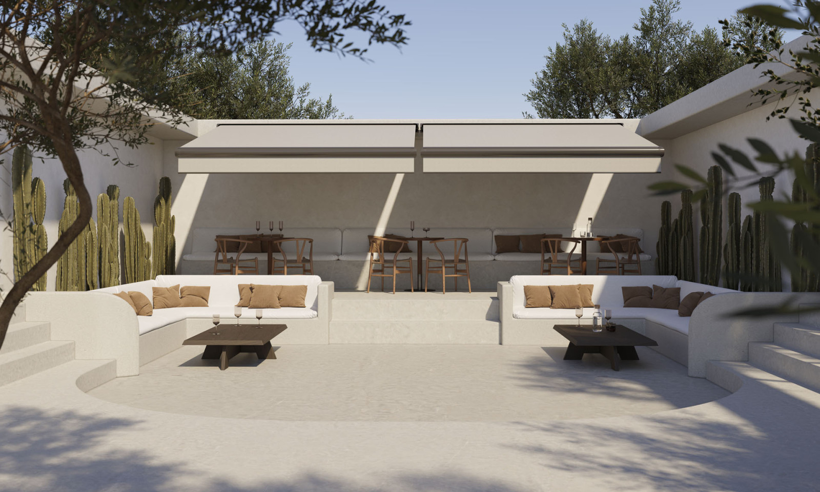 Outdoor seating area with white couches and tables, featuring a Fully Automatic Awning System