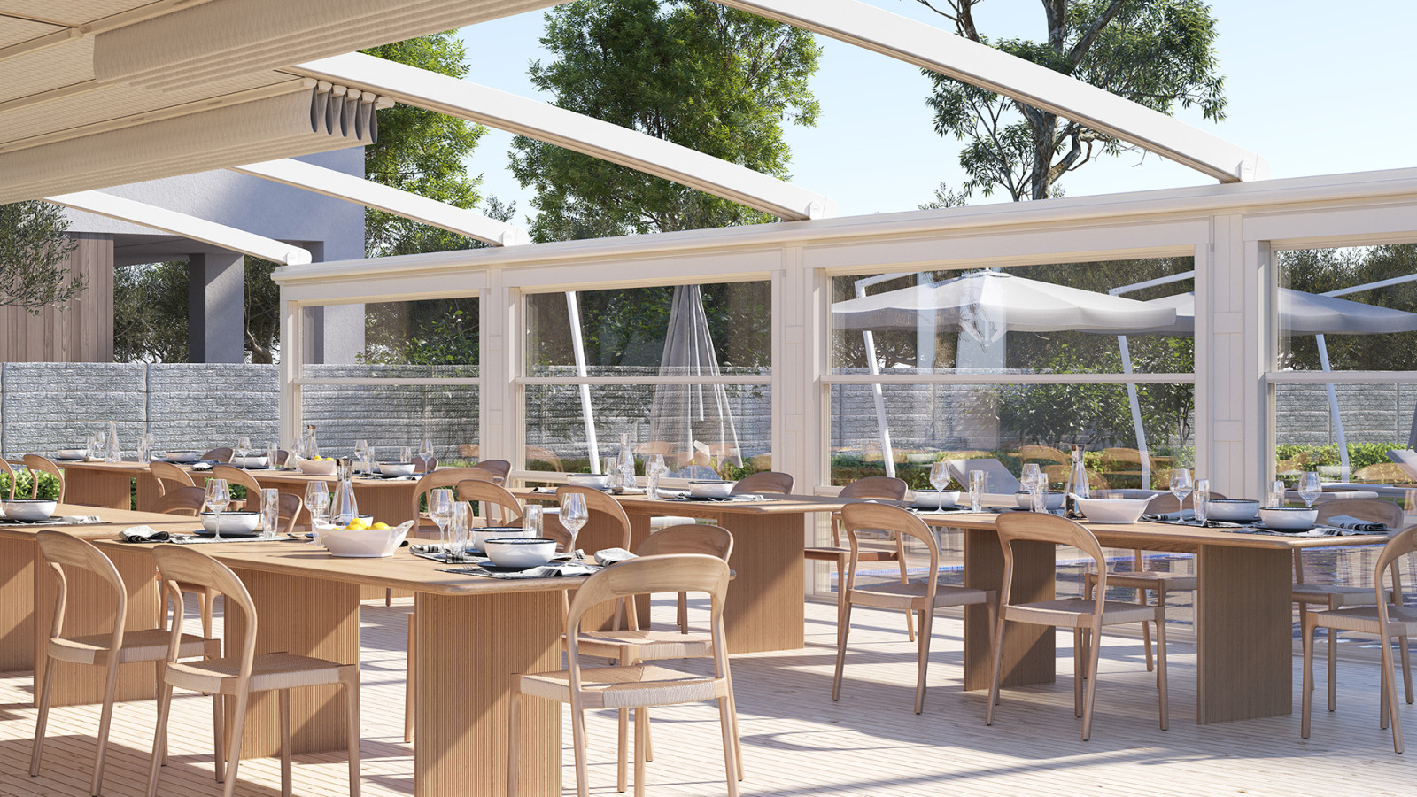 A yard patio featuring a table and chairs, with Parapet Systems in the background.