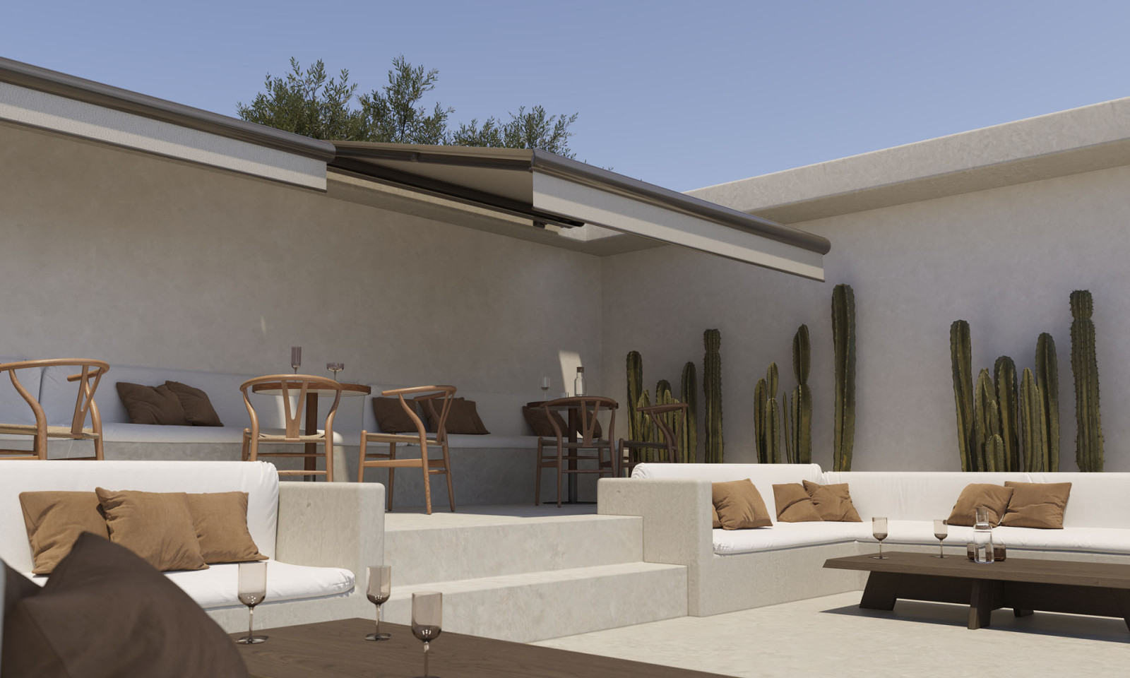 Outdoor seating area with white couches and tables, featuring a Fully Automatic Awning System