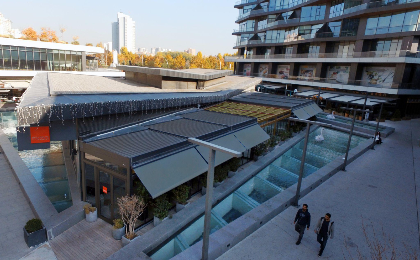 An outdoor space that showcases the four-season usability offered by pergola systems